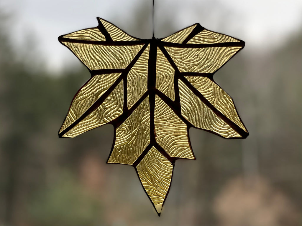 handmade stained glass maple leaf in soft gold