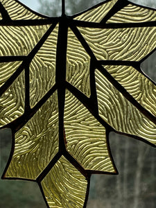 handmade stained glass maple leaf in soft gold