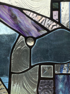 Close up of organic stained glass panel handmade by Julia Brandis.
