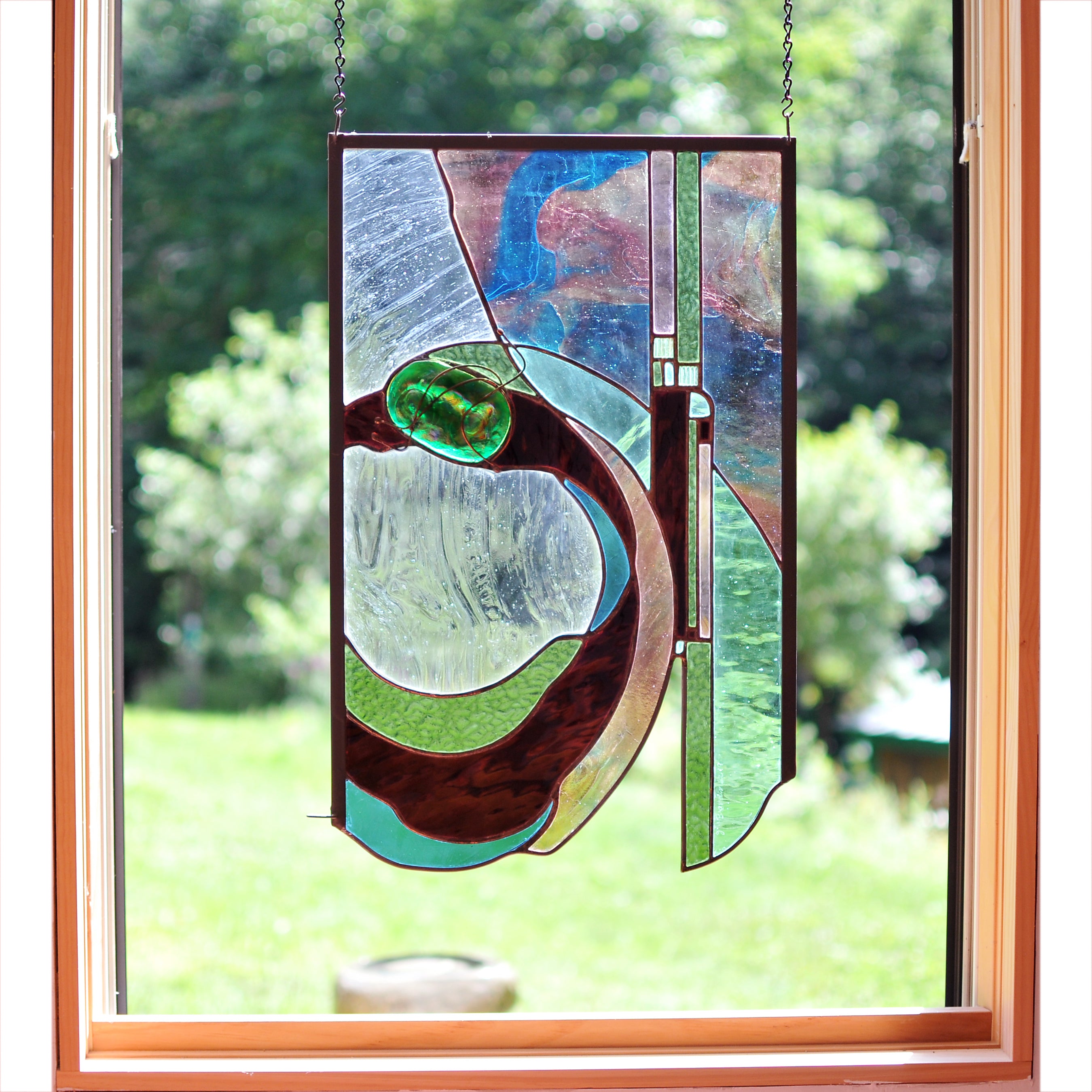 Large stained glass panel with nature inspired organic lines. Organic abstract