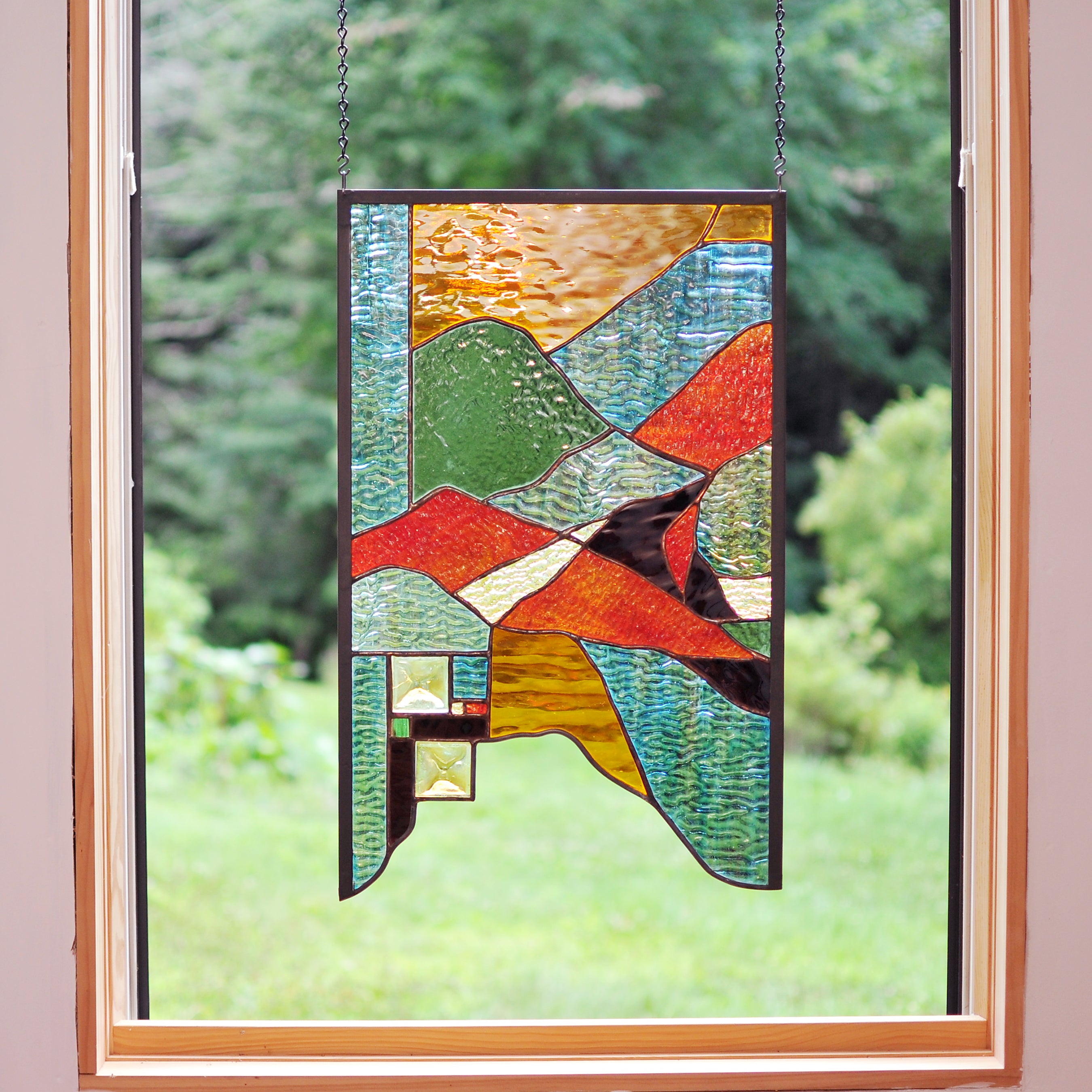 Large stained glass panel with nature inspired organic lines. Organic abstract