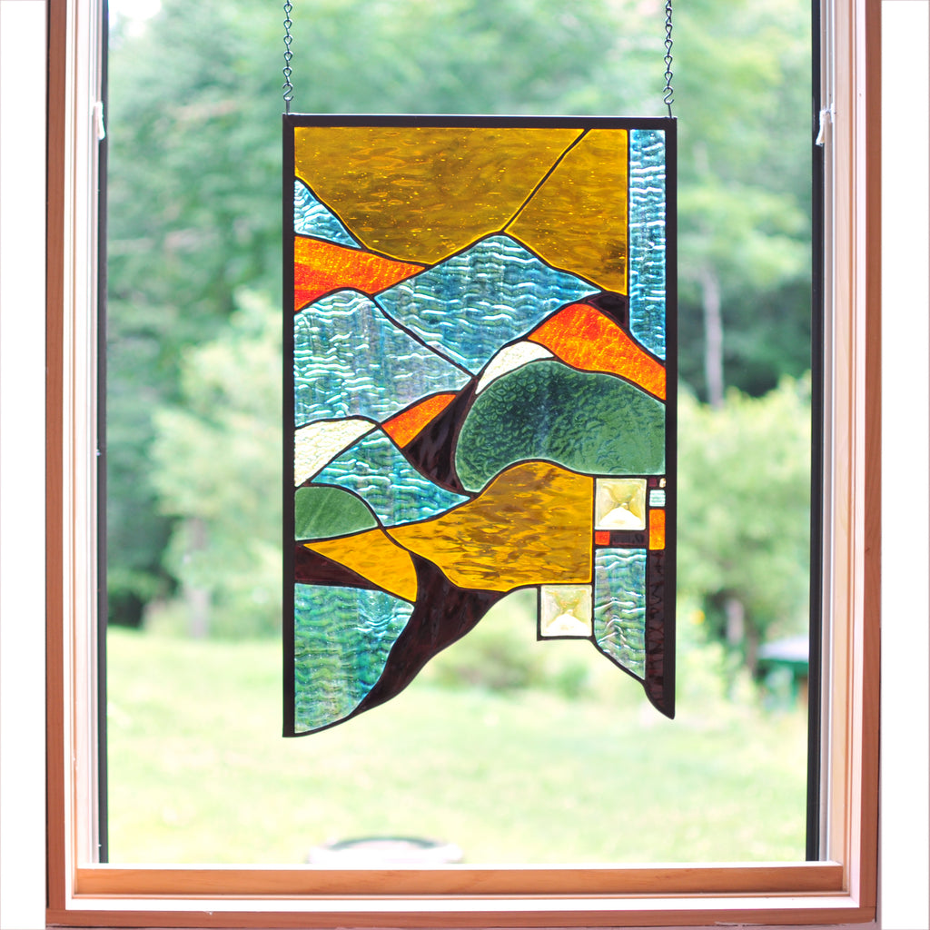 Large stained glass panel with nature inspired organic lines. Organic abstract