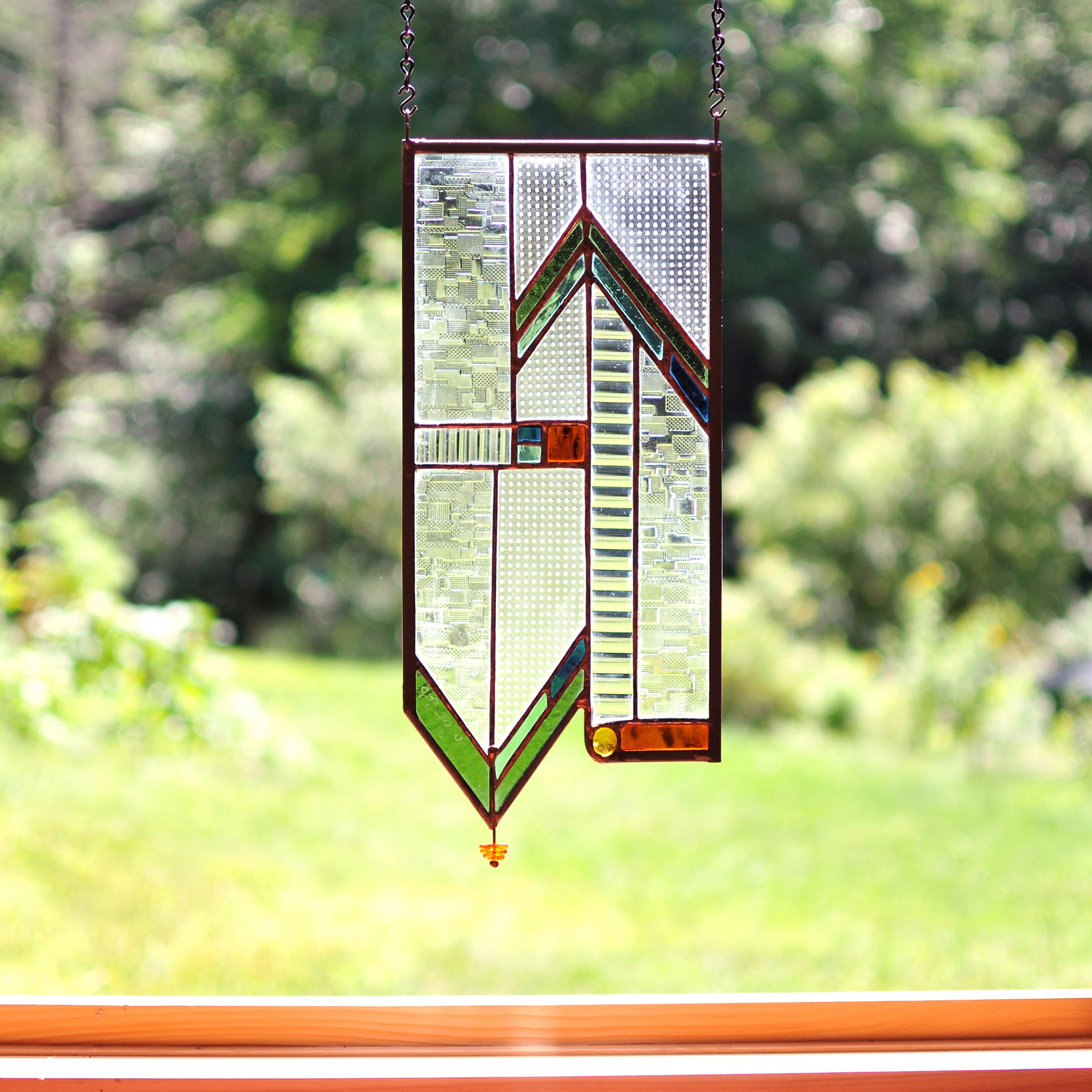 Stained glass panel with architectural lines made by Vermont artist Julia Brandis. Mission style / Prairie style.