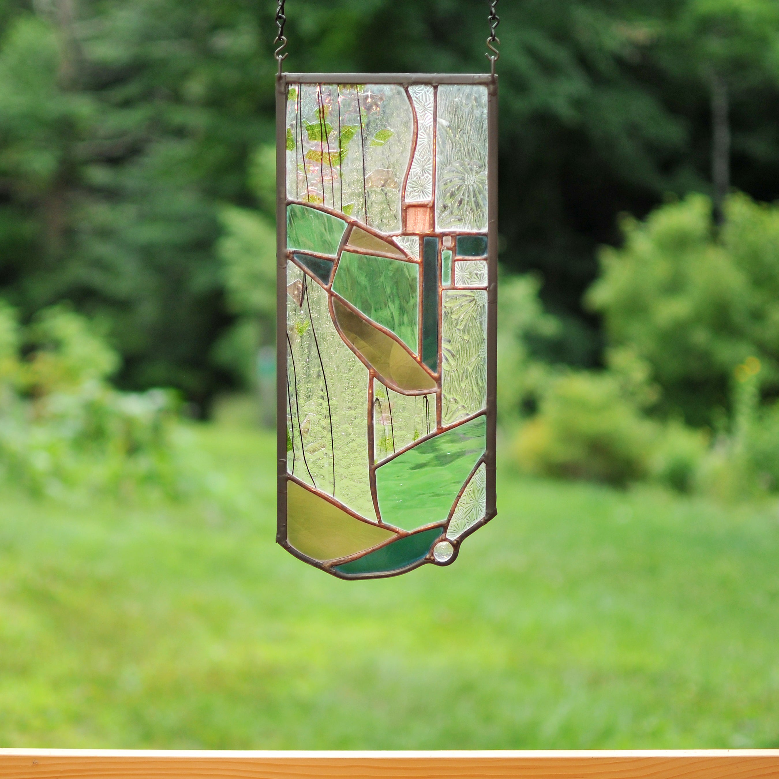 Small stained glass panel with organic lines made by Vermont artist Julia Brandis. Organic abstract.