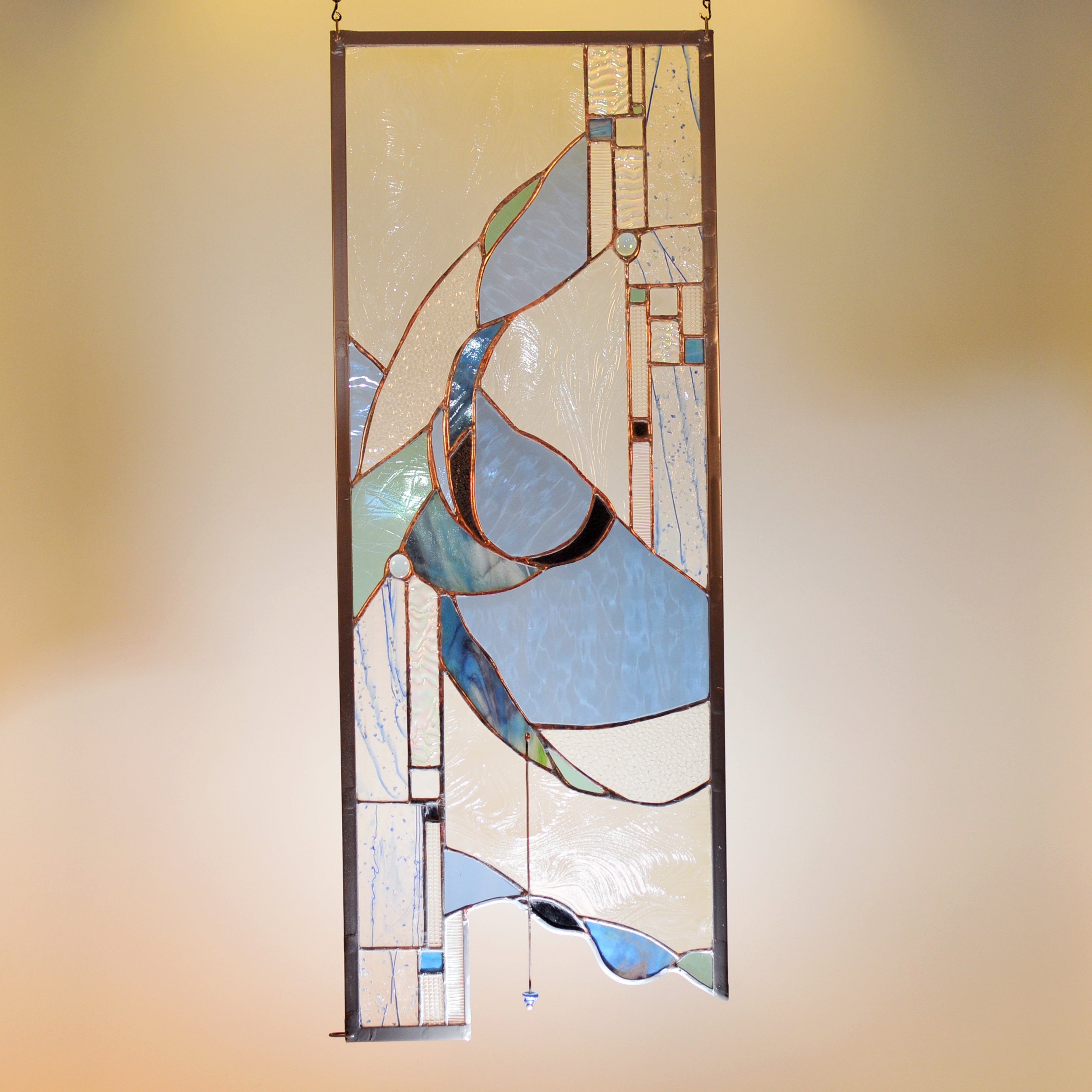 Large stained glass panel with nature inspired organic swirls made by Vermont artist Julia Brandis. Organic abstract.