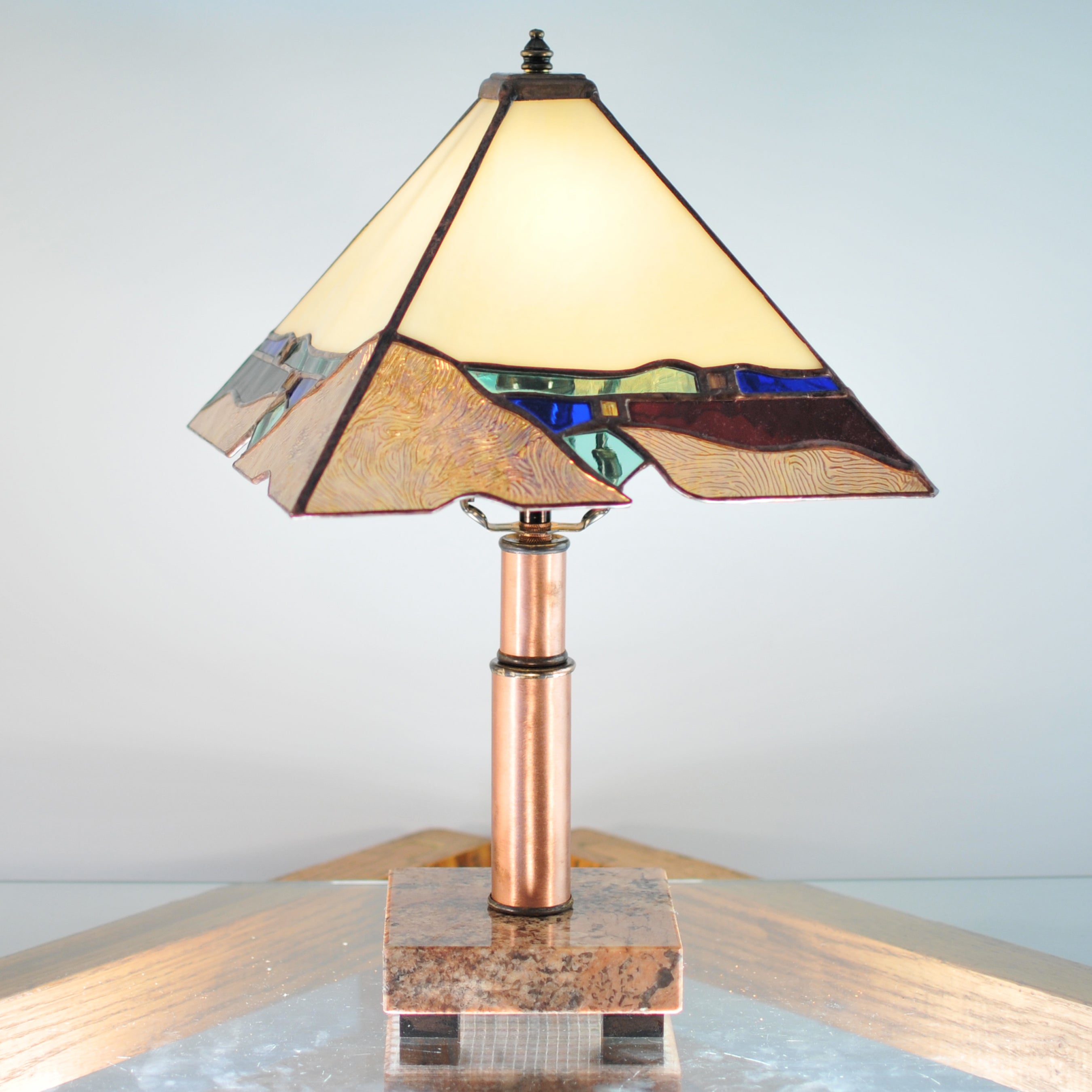 Small stained glass lamp with organic and architectural lines. Mission style / Prairie style.